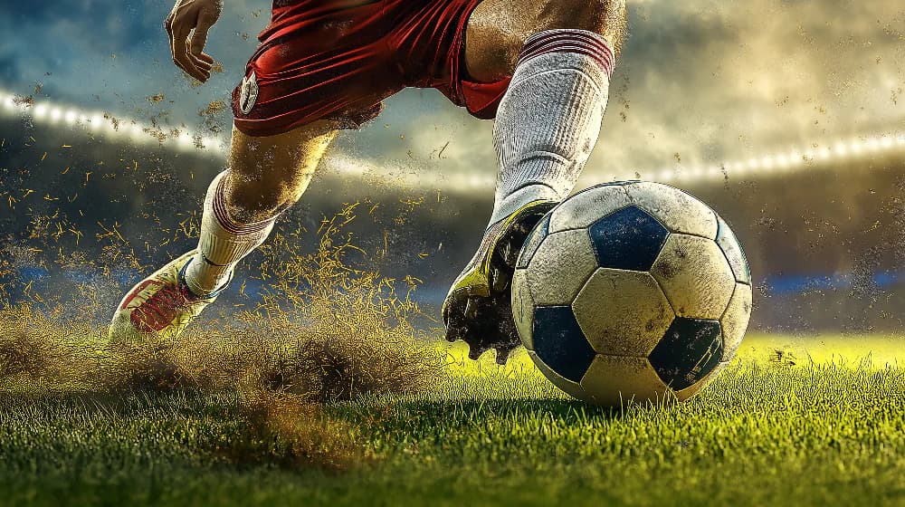 Soccer stadium filled with cheering fans during a match